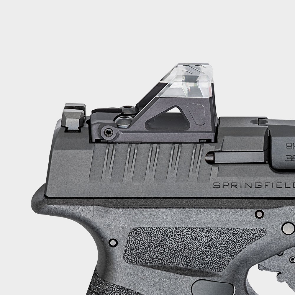 Pistola Springfield Armory Hellcat com mira óptica vista de perfil.